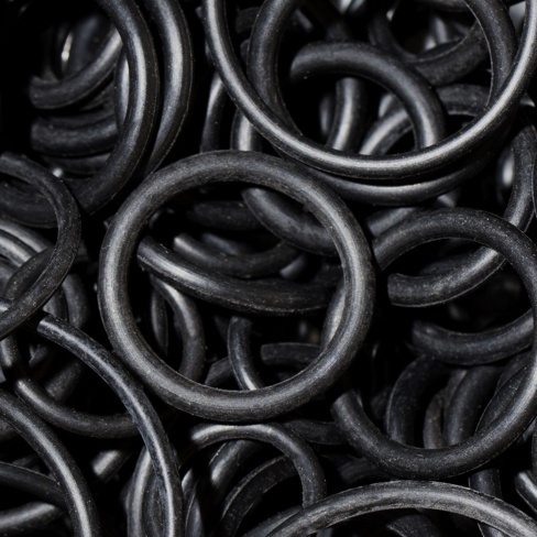 Pile of black quality o-ring seals up-close.